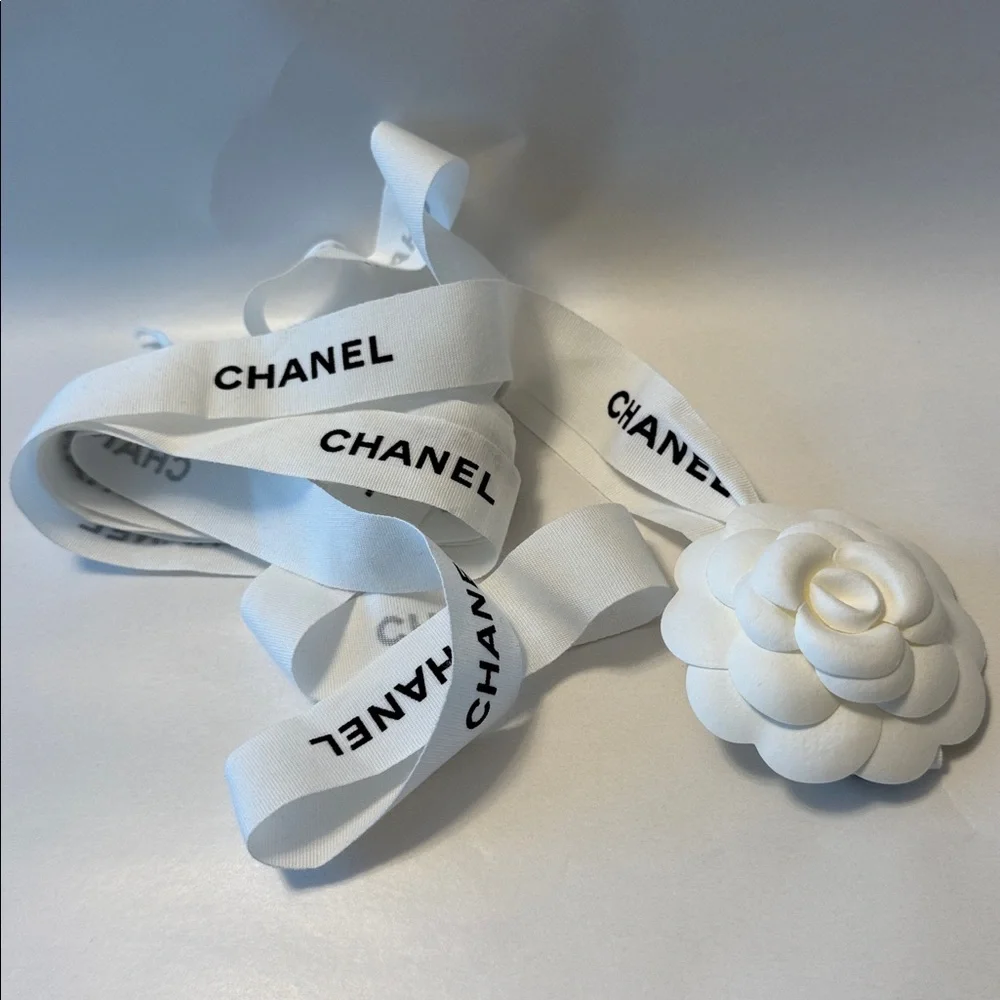 CHANEL 1 CAMELIA FLOWER AND Silver Chanel printed RIBBON,  plus Chanel card.